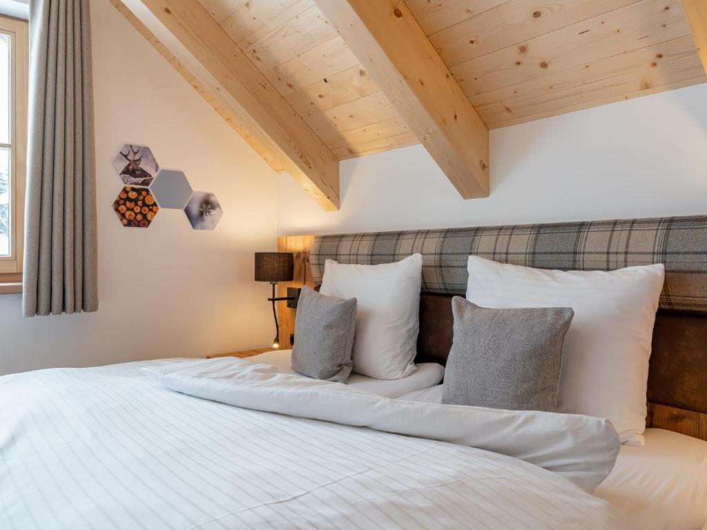 Postel nebo postele na pokoji v ubytování Alpenjoy Lodge