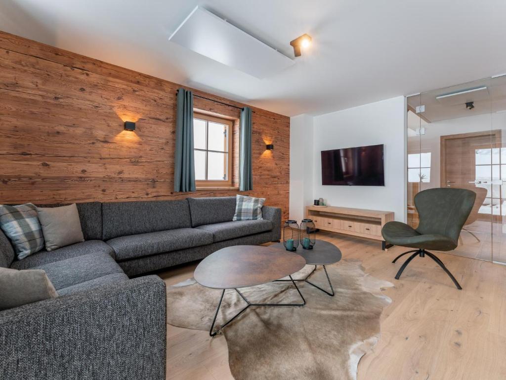 TV a/nebo společenská místnost v ubytování Alpenjoy Lodge
