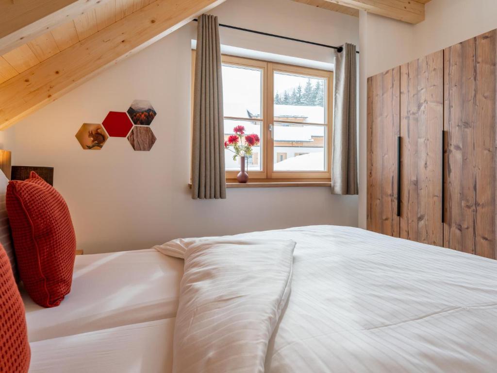 Postel nebo postele na pokoji v ubytování Alpenjoy Lodge
