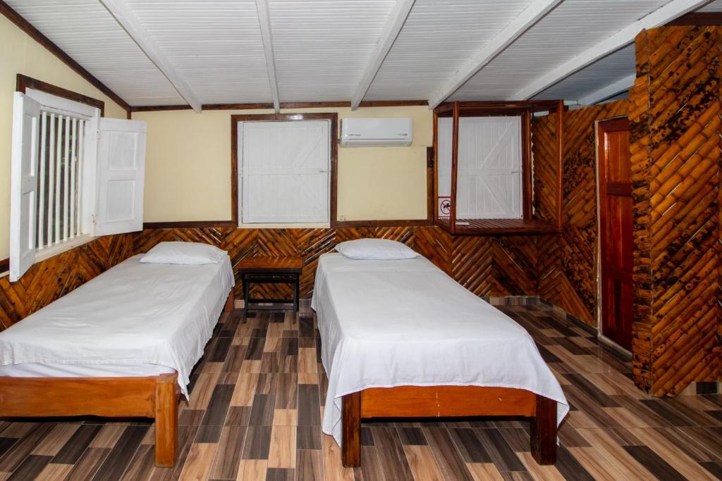 Postel nebo postele na pokoji v ubytování Hotel Kipara