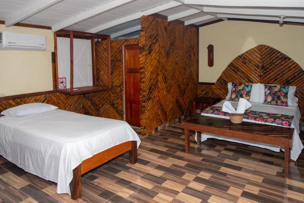 Postel nebo postele na pokoji v ubytování Hotel Kipara