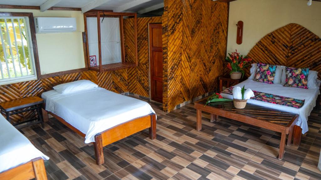 Postel nebo postele na pokoji v ubytování Hotel Kipara