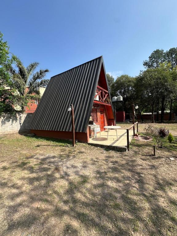 a small red building with a black roof at Cabañas Ecoturisticas del Valle de Yala alpina in Yala