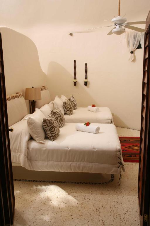 Postel nebo postele na pokoji v ubytování Hotel Okaan