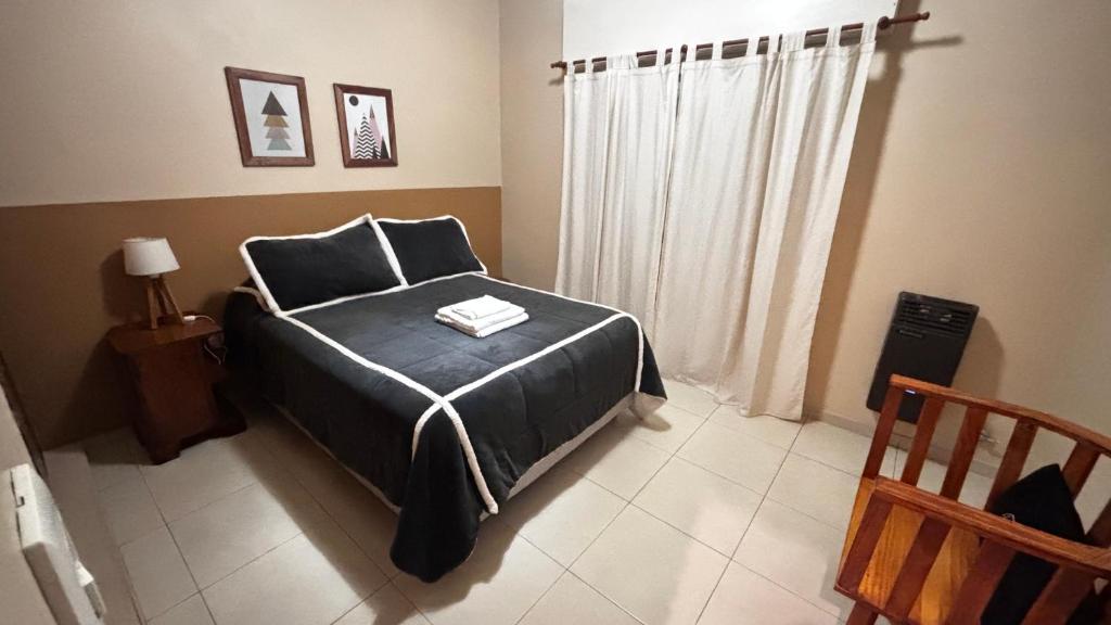 Giường trong phòng chung tại Departamento 3