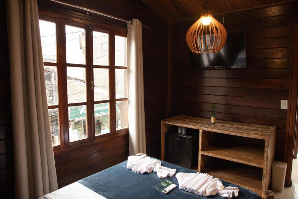 Postel nebo postele na pokoji v ubytování Lonier Nature INN