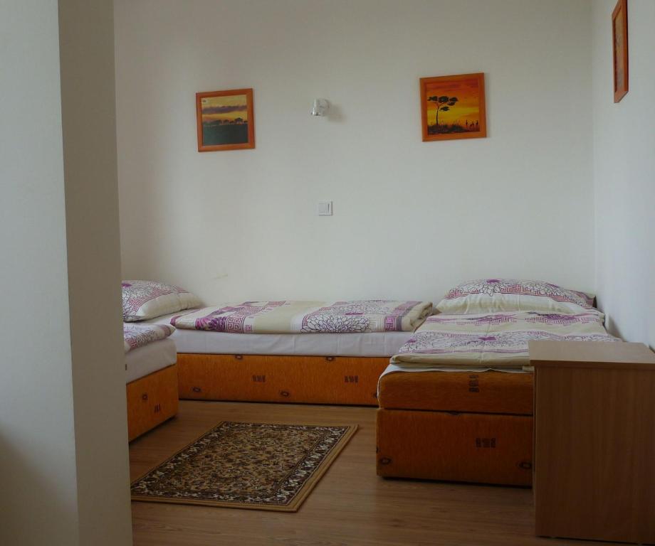 Postel nebo postele na pokoji v ubytování Touring & Sport Hotel Siófok