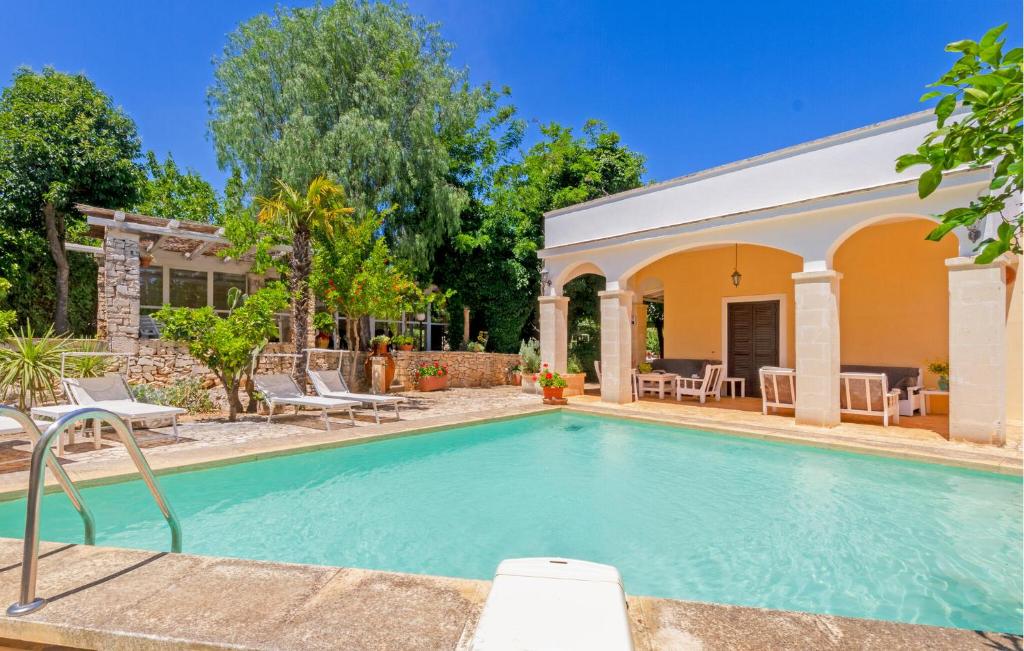 a swimming pool in the backyard of a house at Casal Del Borgo 3 in Ostuni