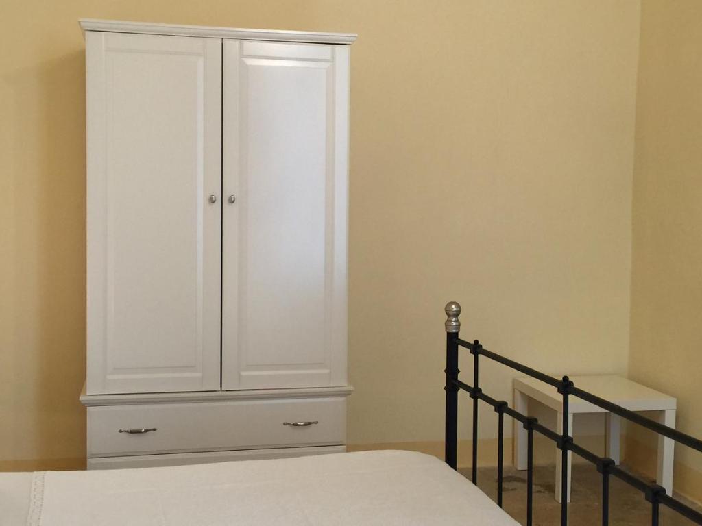 A bed or beds in a room at Palazzo Doxi Fontana Dimora Storica