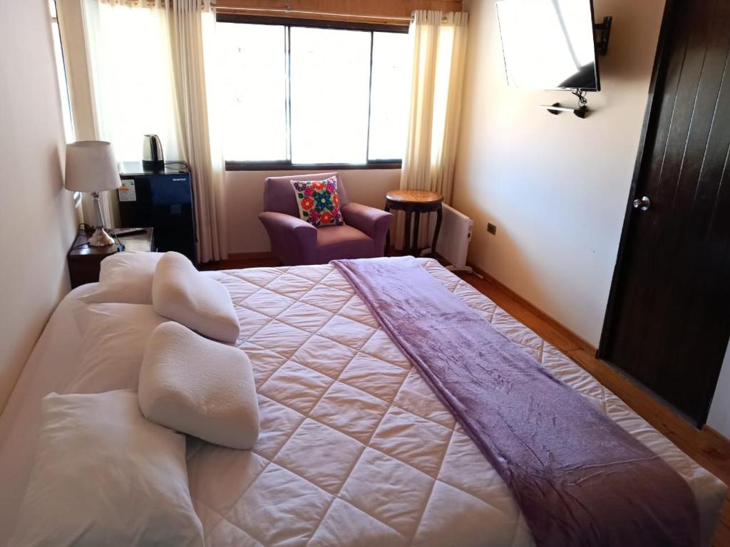 Ένα ή περισσότερα κρεβάτια σε δωμάτιο στο Casona Tupac Hotel Cusco