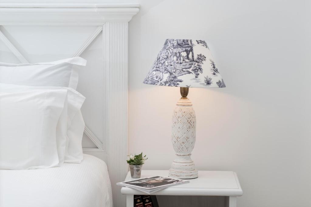 Postel nebo postele na pokoji v ubytování La Mision Hotel Boutique