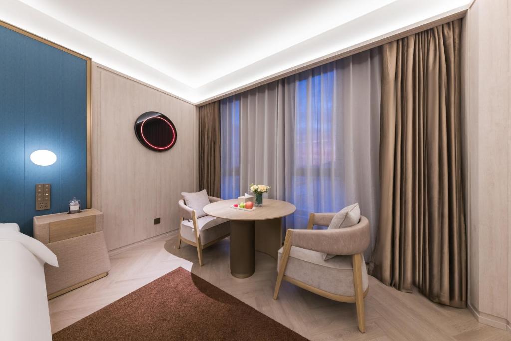 Posezení v ubytování Tianjin Baodi Economic Development Zone Orange Crystal Hotel