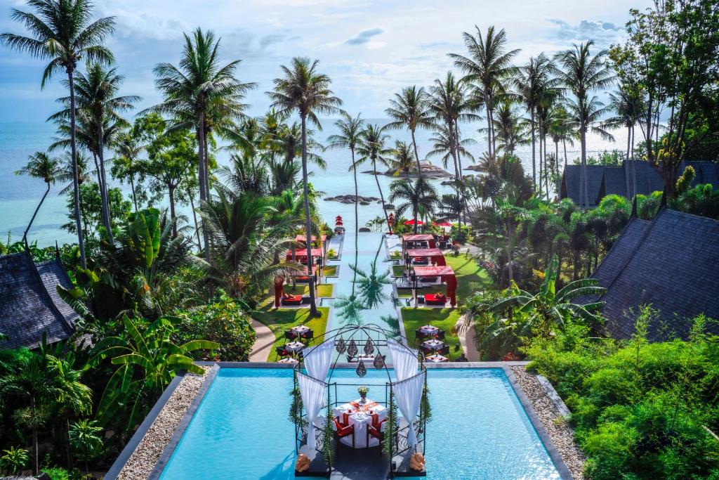 an aerial view of the pool at the resort at Kupu Kupu Phangan Beach Villas & Spa in Haad Pleayleam
