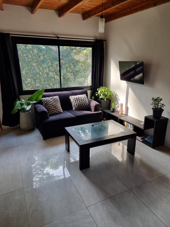a living room with a couch and a coffee table at Lemuria - a 350m de Playa - Mar Azul in Mar Azul