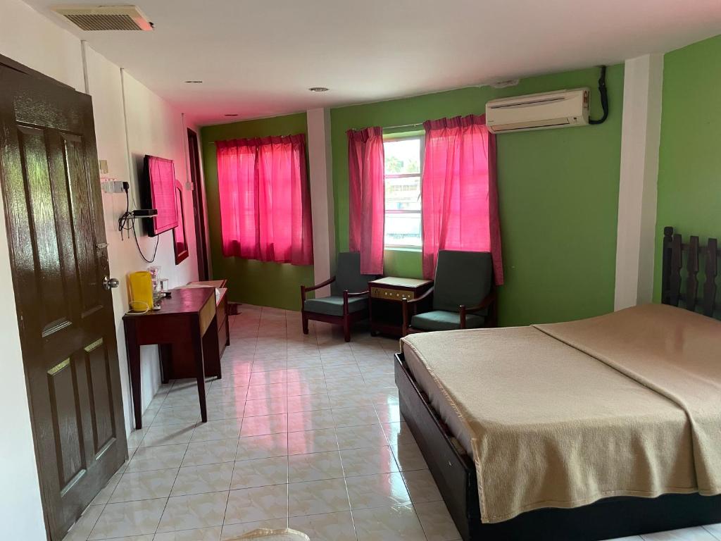 Postel nebo postele na pokoji v ubytování Hotel Medan Kidd