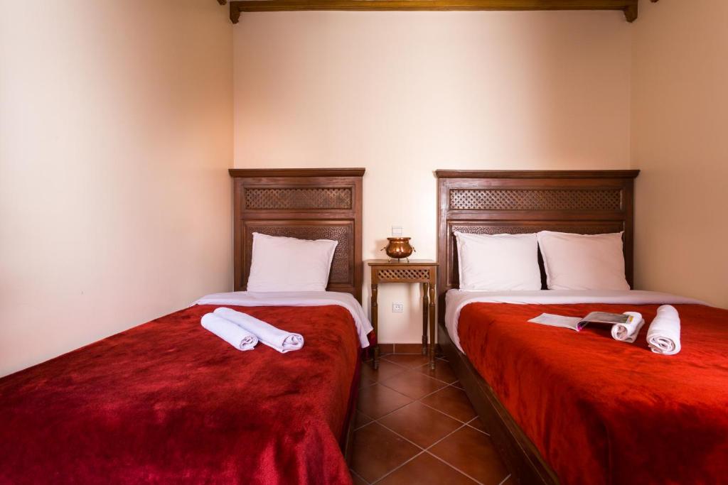 Cama o camas de una habitación en Hotel Atlas
