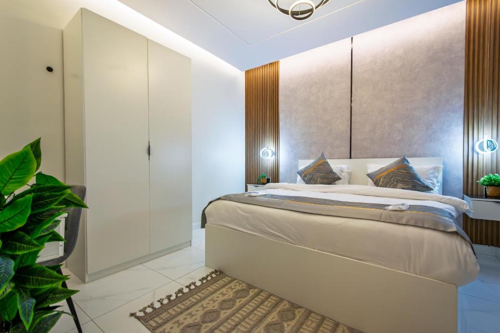 Postel nebo postele na pokoji v ubytování شقة الياسمين 1 Alyasmin Residence