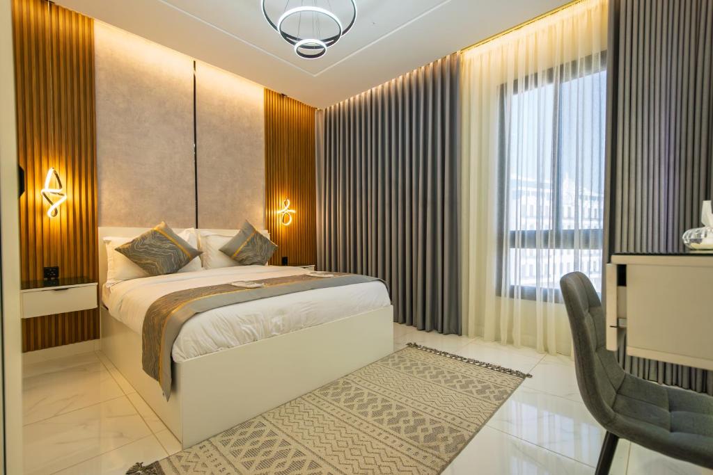 Postel nebo postele na pokoji v ubytování شقة الياسمين 1 Alyasmin Residence