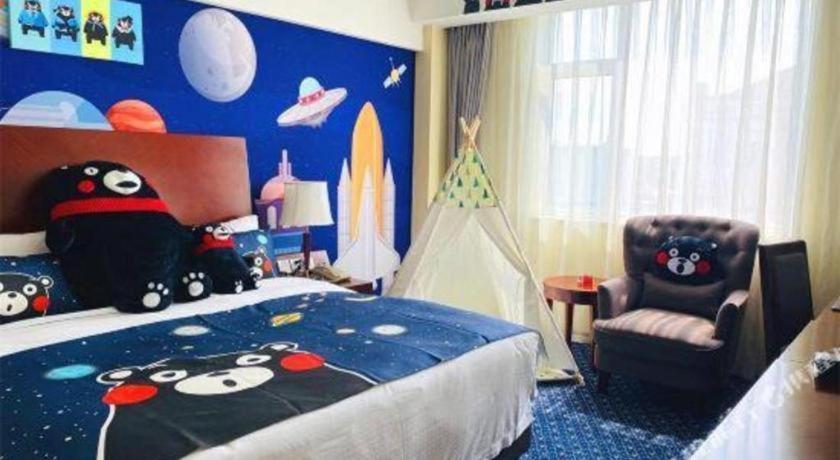 a bedroom with a bed with a cartoon characters on it at Argyle International Airport Hotel Shanghai in Shanghai