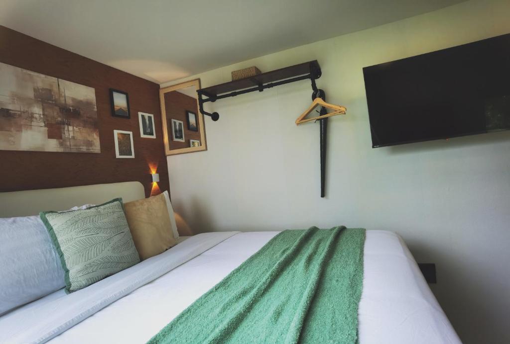Postel nebo postele na pokoji v ubytování How Hide Homestay