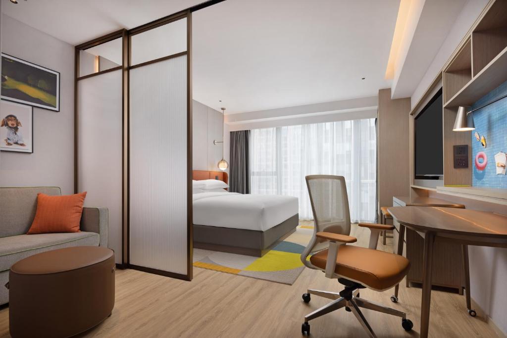 Postel nebo postele na pokoji v ubytování Hilton Garden Inn Chengdu Qingyang