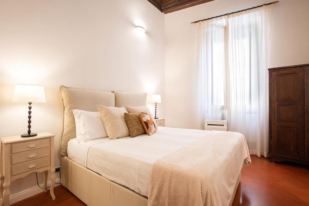 Posteľ alebo postele v izbe v ubytovaní Avila Palace Piazza Navona