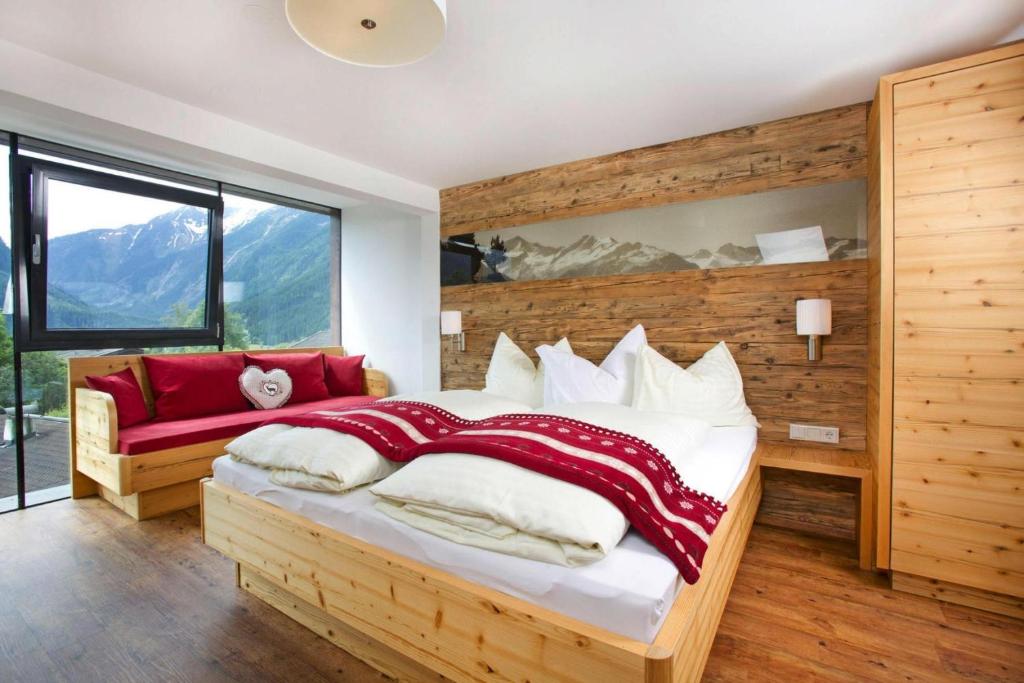 A bed or beds in a room at Apartment in Neukirchen with a balcony