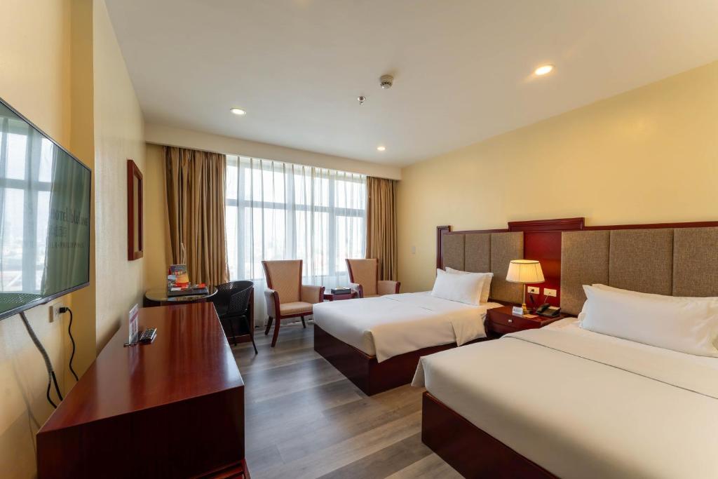 Postel nebo postele na pokoji v ubytování Swiss-Belhotel Blulane