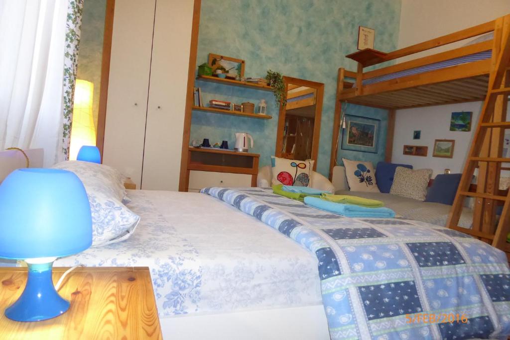 Postel nebo postele na pokoji v ubytování B&B Al Santo