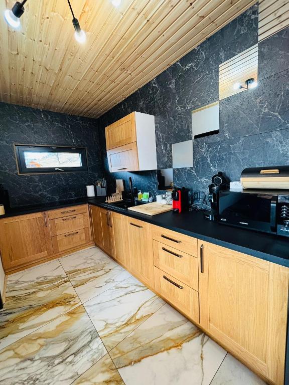 Kuchyň nebo kuchyňský kout v ubytování Cabana MIYA