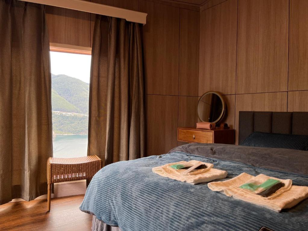 Ένα ή περισσότερα κρεβάτια σε δωμάτιο στο Lishan House