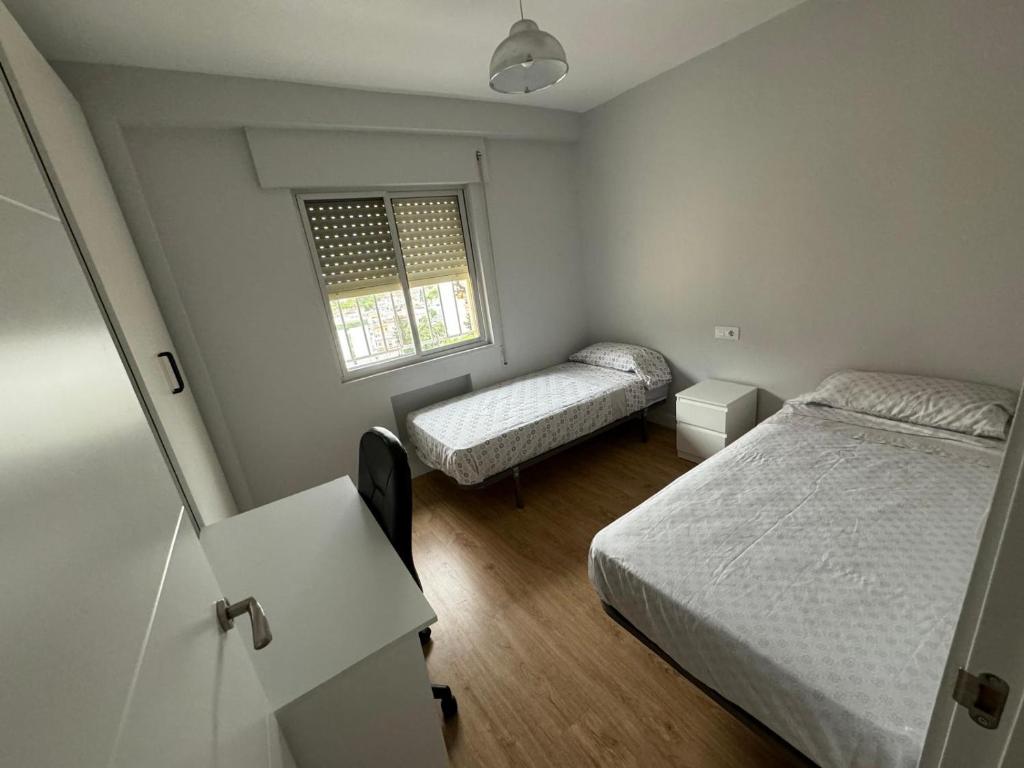 Postel nebo postele na pokoji v ubytování XRYHOMES II Residencial en Jerez con 3 hab, 6pax, a 10 min del centro