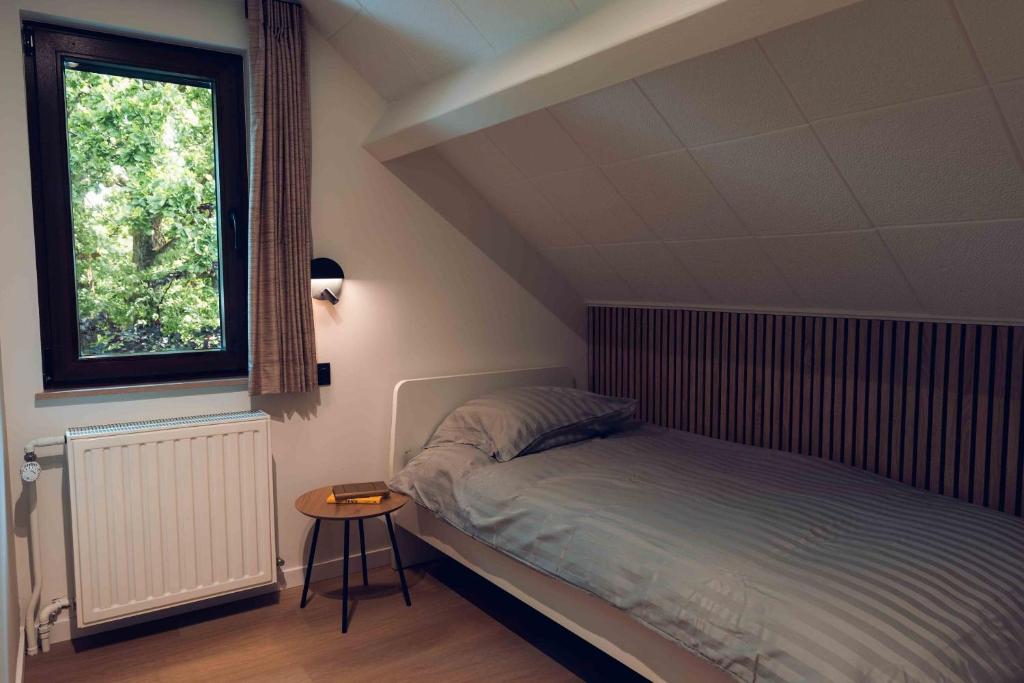 Postel nebo postele na pokoji v ubytování Chalet de Botrange