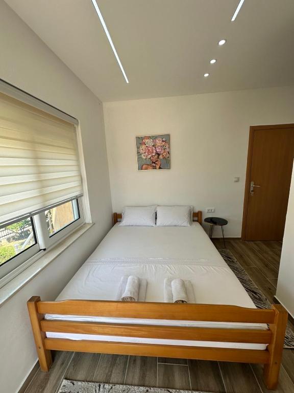 Postel nebo postele na pokoji v ubytování Ceka Apartments