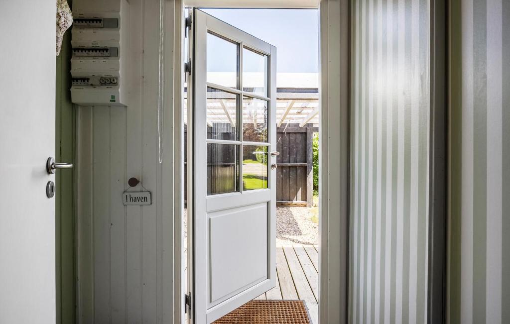 an open door leading to a patio with a porch at Nice Home In Haderslev With Wifi in Haderslev