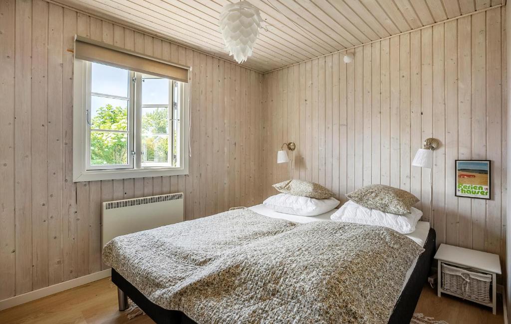 a bedroom with a bed and a window at Nice Home In Haderslev With Wifi in Haderslev