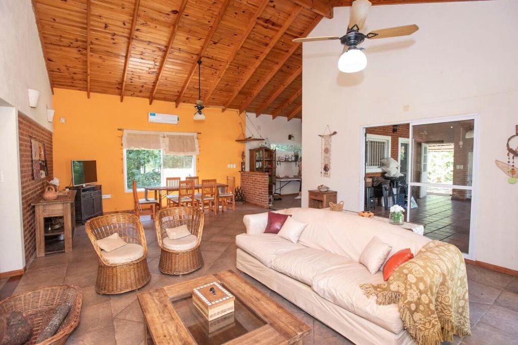a living room with a couch and a table at Quinta La Soñada in Etchegoyen
