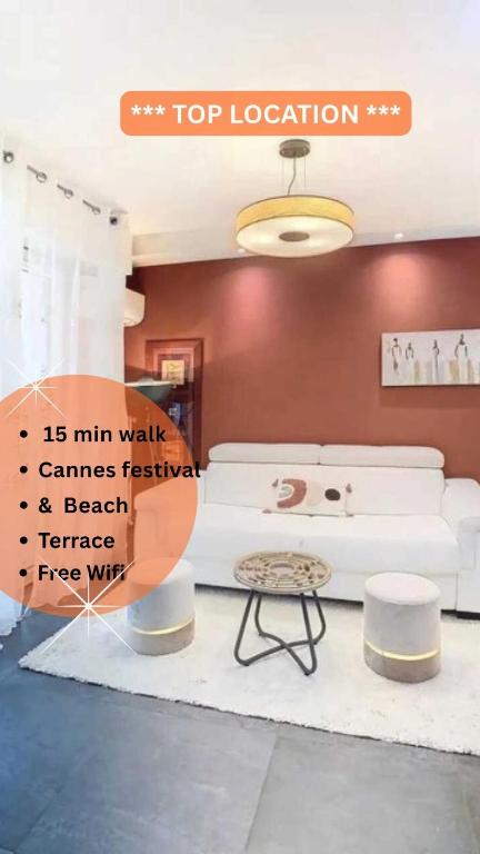 un salon avec un canapé blanc et une table dans l'établissement F3 4 pers 15 min Palace Cannes, à Cannes