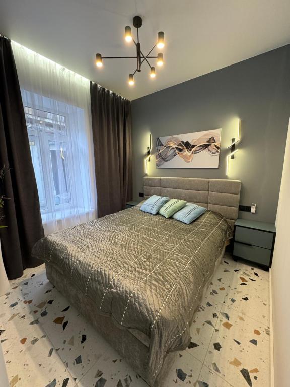 Ένα ή περισσότερα κρεβάτια σε δωμάτιο στο Apartment on Snijna street 5