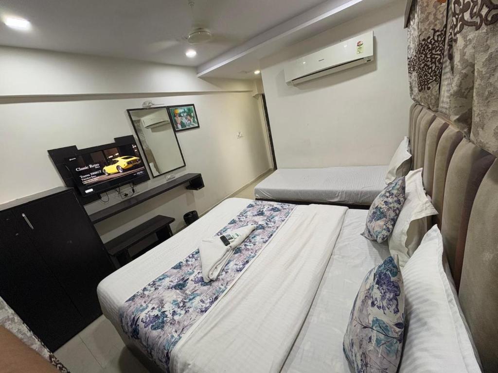 Postel nebo postele na pokoji v ubytování HOTEL DREAM INN