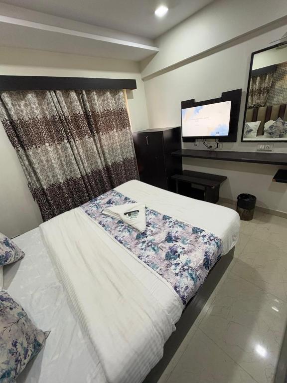 Postel nebo postele na pokoji v ubytování HOTEL DREAM INN