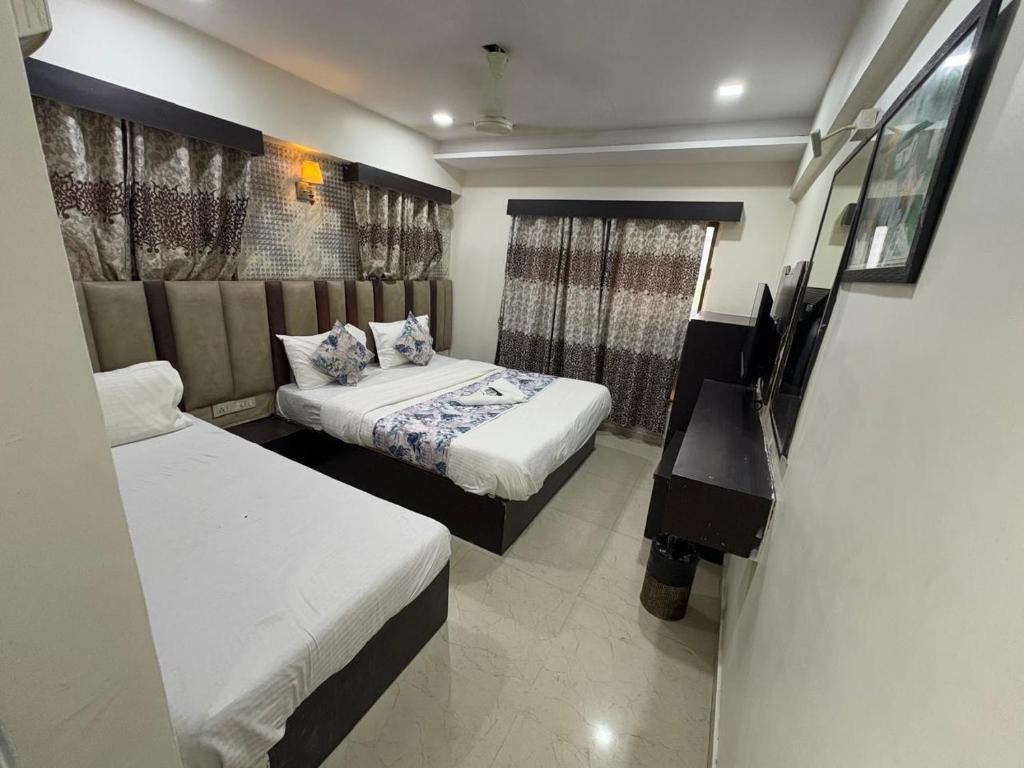 Postel nebo postele na pokoji v ubytování HOTEL DREAM INN