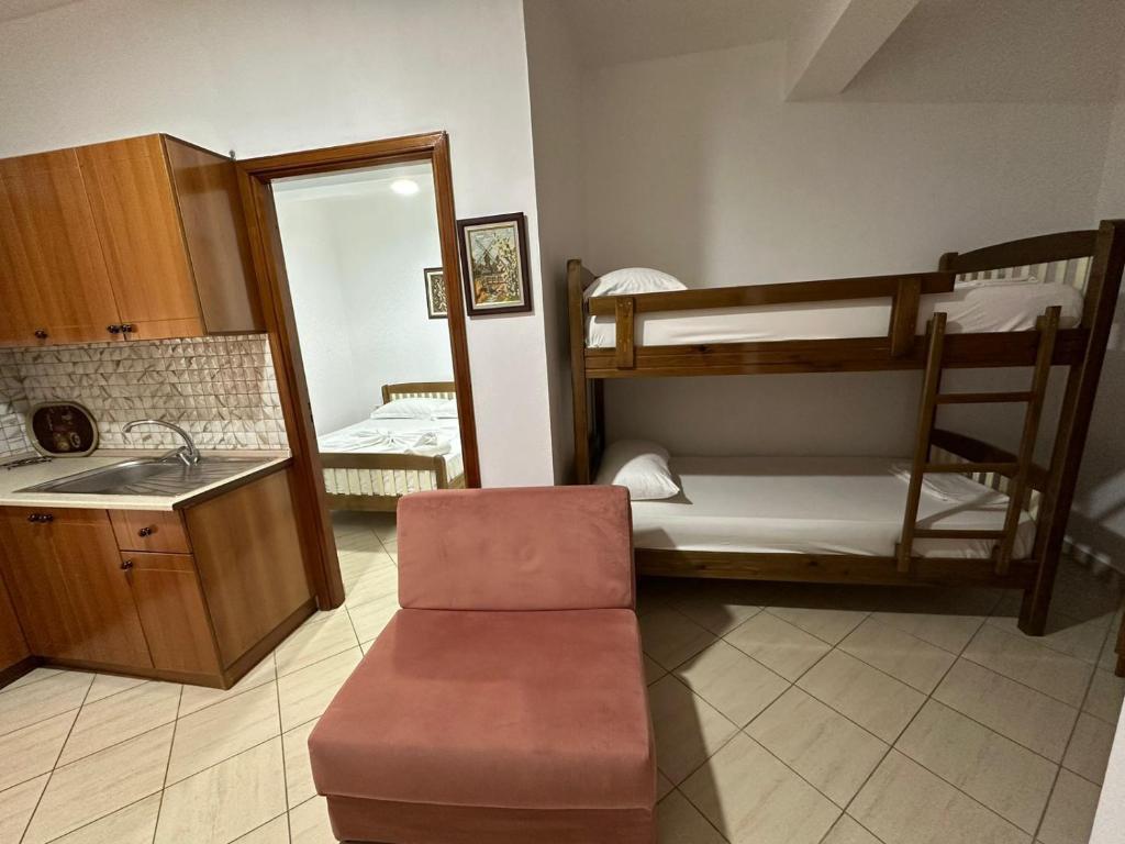 a living room with two bunk beds and a sink at Apartment Radhima in Vlorë