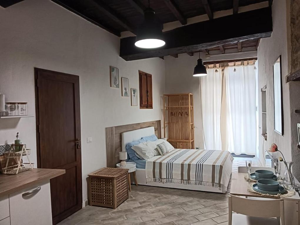 Postel nebo postele na pokoji v ubytování Cami Suite - monolocale a Spoleto