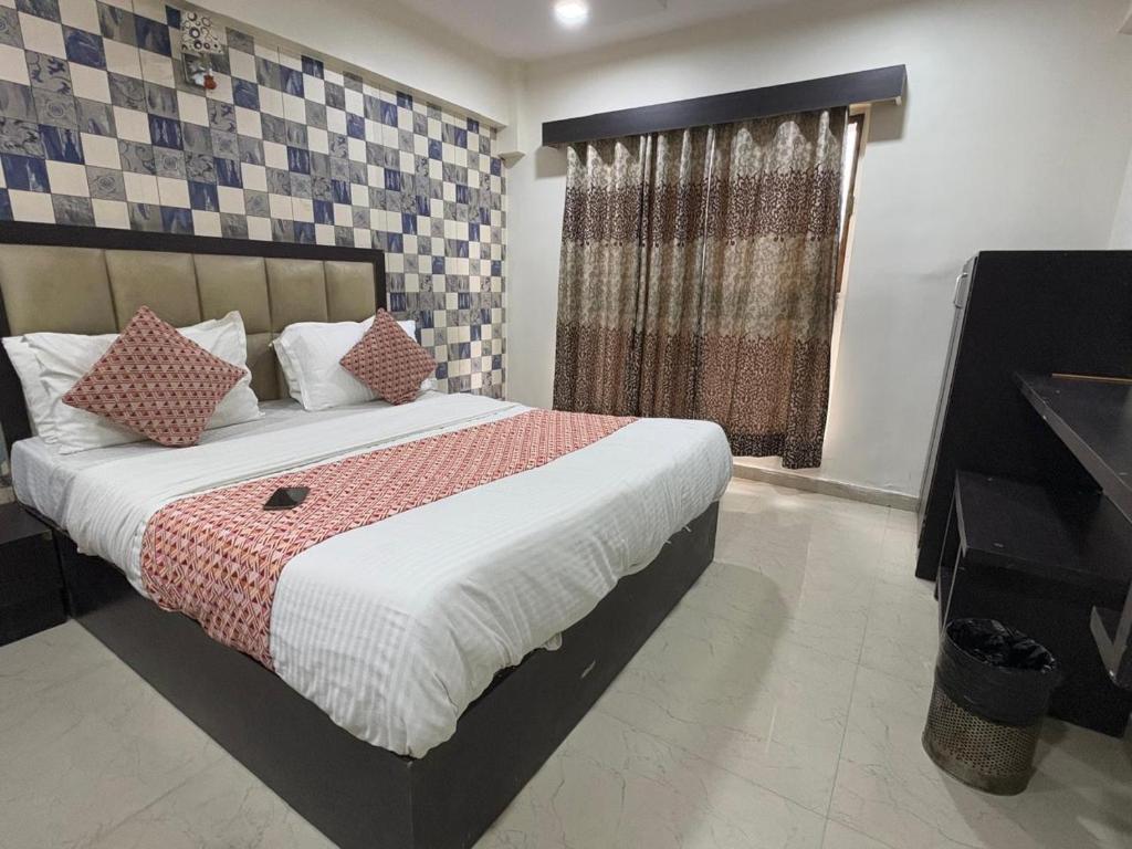 Postel nebo postele na pokoji v ubytování HOTEL DREAM INN