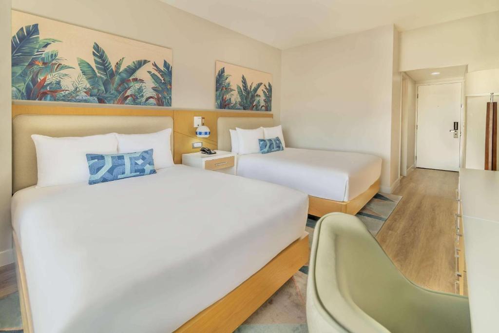 Postel nebo postele na pokoji v ubytování Radisson Resort Miami Beach