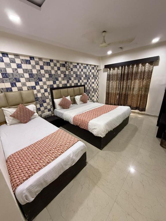 Postel nebo postele na pokoji v ubytování HOTEL DREAM INN