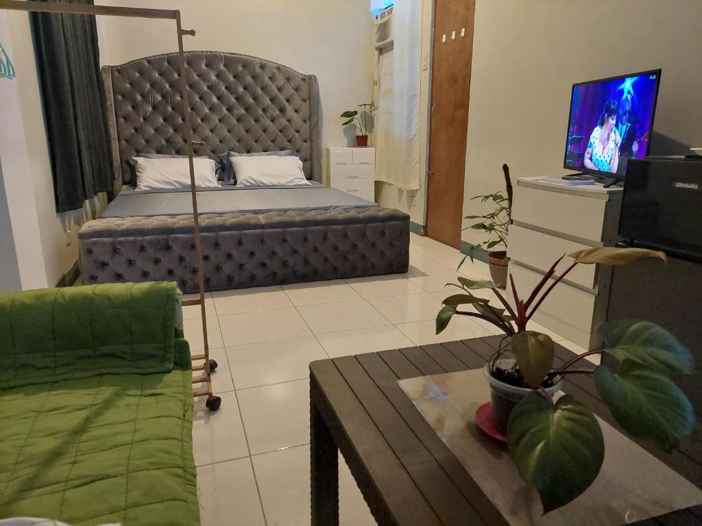 TV a/nebo společenská místnost v ubytování GGGO RESIDENCES, Studio 103, King