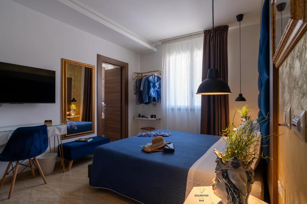 A bed or beds in a room at Diamond