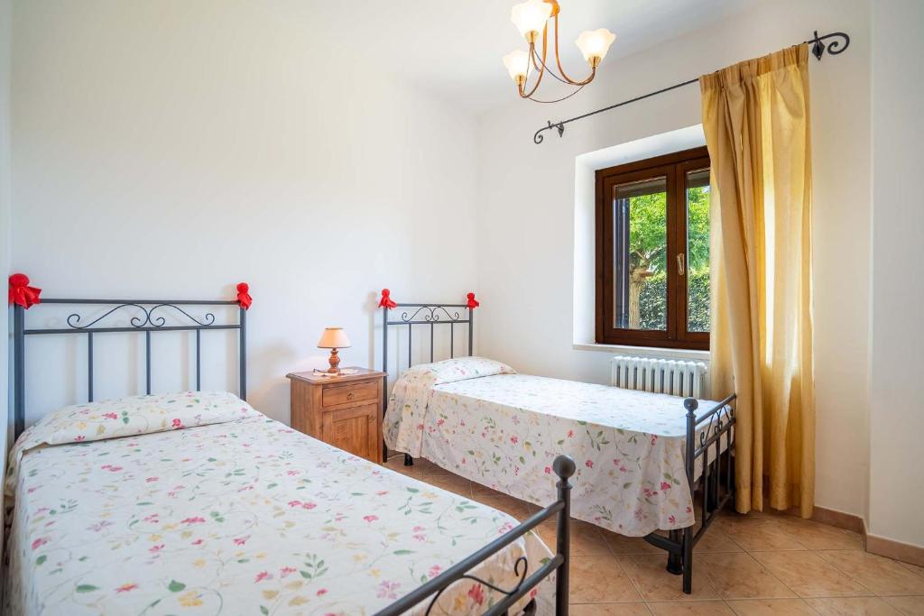 Postel nebo postele na pokoji v ubytování Stella fiorita